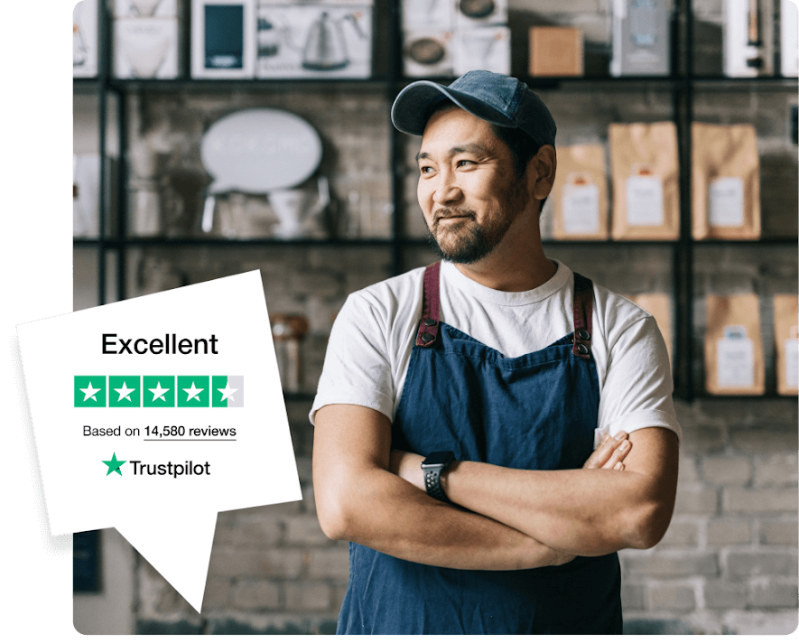 Stock image of a smiling small business owner in apron standing in a coffee shop, next to a Trustpilot badge showing excellent rating